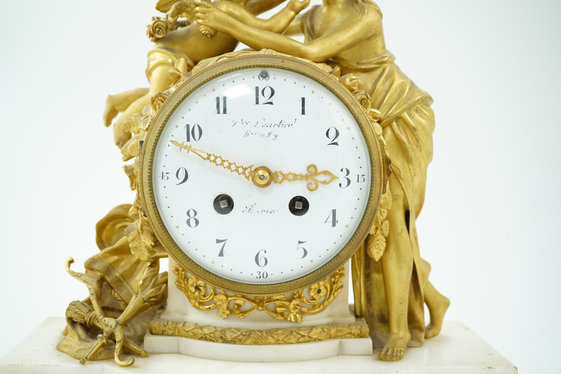 An early 19th century French figural ormolu and white marble mantel clock